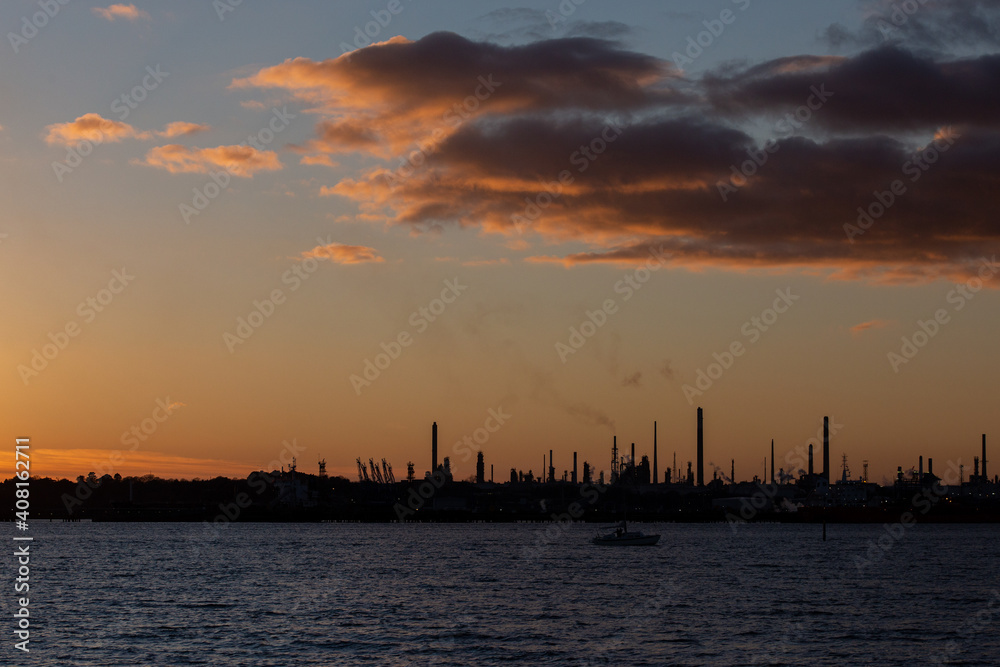 Fawley oil refinery Hampshire, England at dusk. Oil refinery energy production fossil fuels pollution environmental impact
