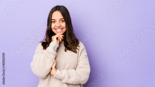 Young mixed race hispanic woman isolated smiling happy and confident, touching chin with hand.