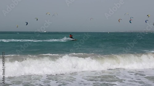 Kite surfers in the water on Dubai beach