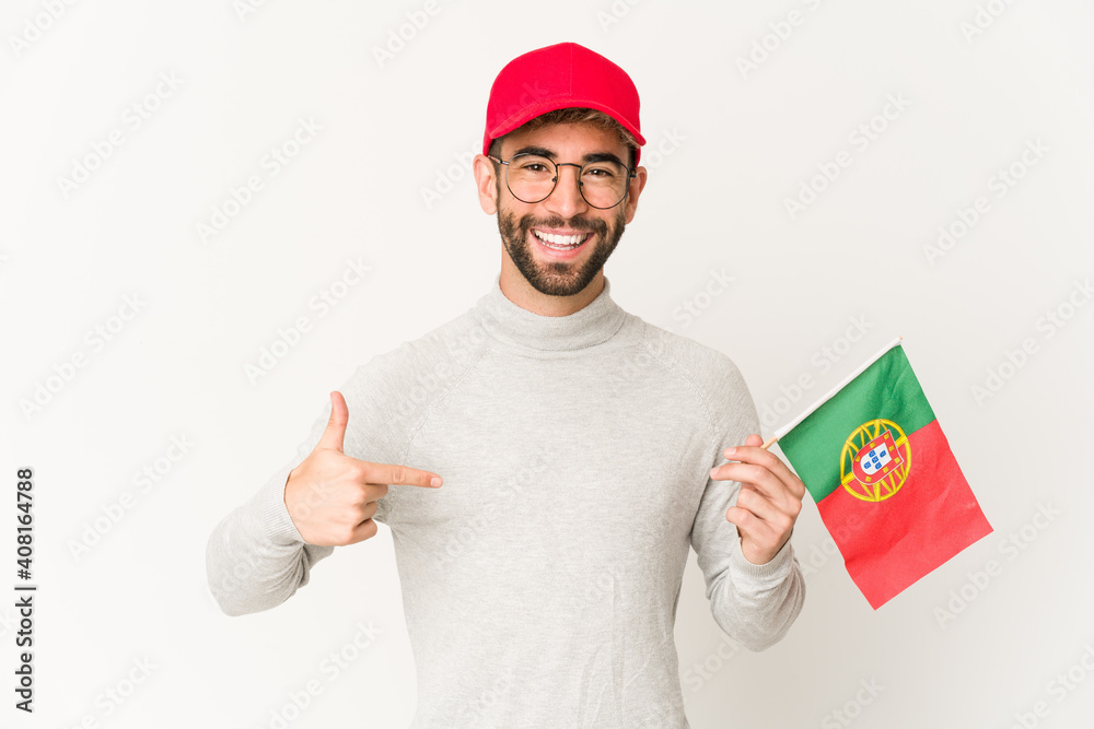 Young hispanic mixed race woman holding a portugal flag person pointing by hand to a shirt copy space, proud and confident Young hispanic mixed race woman holding a portugal flag person pointing by hand to a shirt copy space, proud and confident