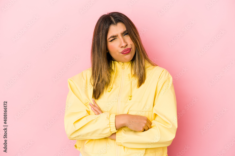 Young indian woman isolated on pink background unhappy looking in camera with sarcastic expression. Young indian woman isolated on pink background unhappy looking in camera with sarcastic expression.
