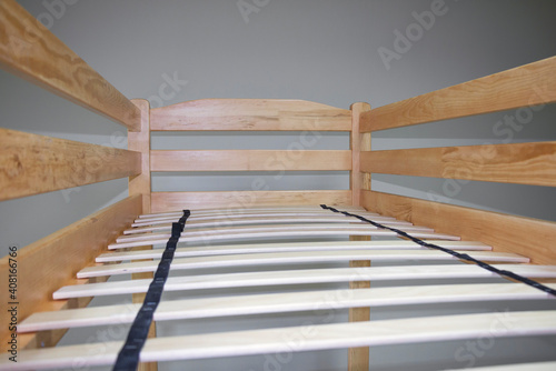 bunk wooden bed with slats and ladder