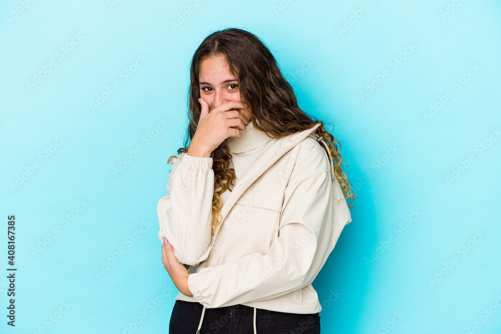 Young caucasian curly hair woman isolated laughing happy, carefree, natural emotion. Young caucasian curly hair woman isolated laughing happy, carefree, natural emotion.
