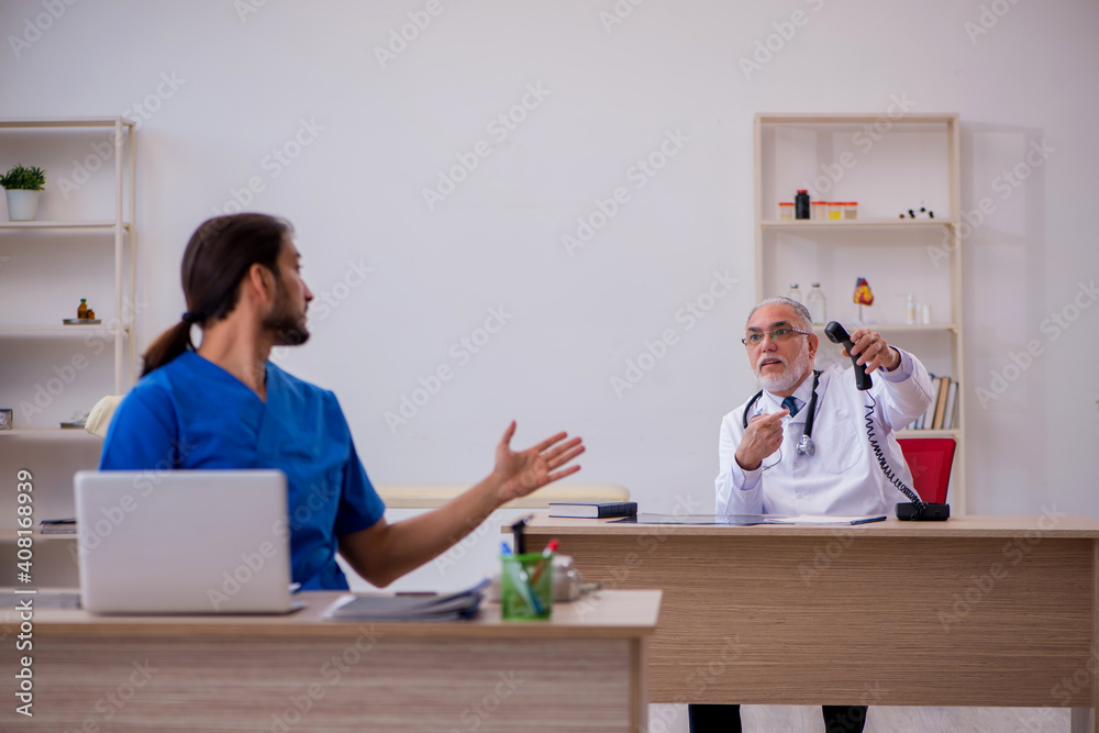 Two doctors working in the clinic Two doctors working in the clinic