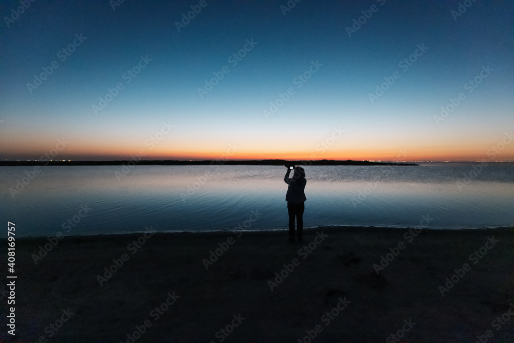 silhouette of a person on the beach