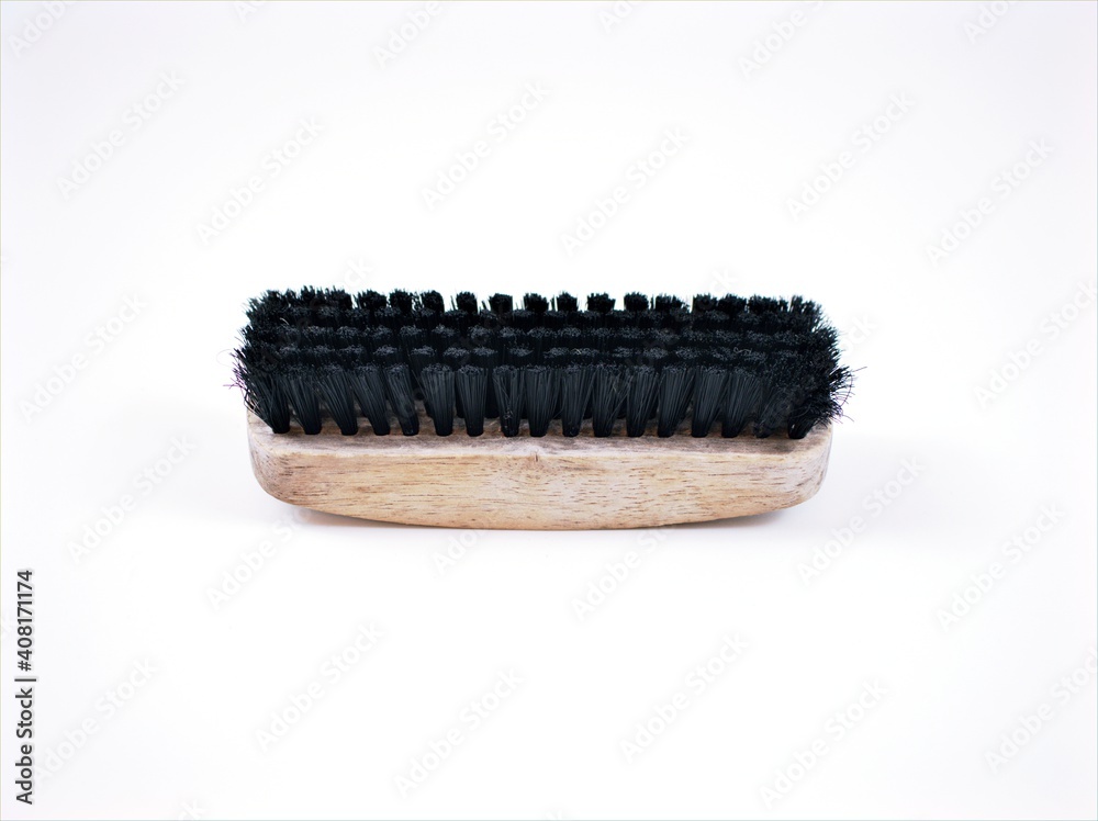 Old black bristles shoe brush isolated on white background ,used brush Old black bristles shoe brush isolated on white background ,used brush