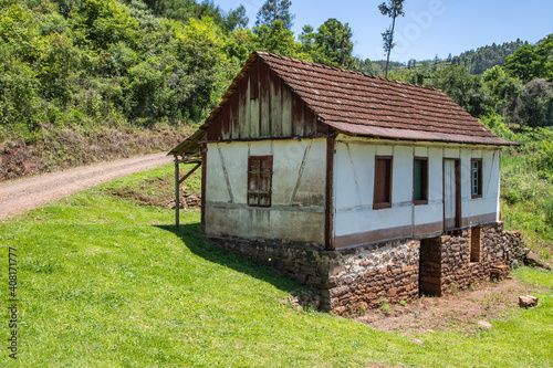 Small enxaimel house with vegetation around