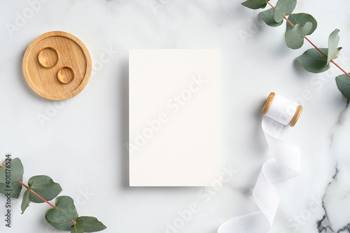Canvas Print Wedding invitation card and greenery on marble table