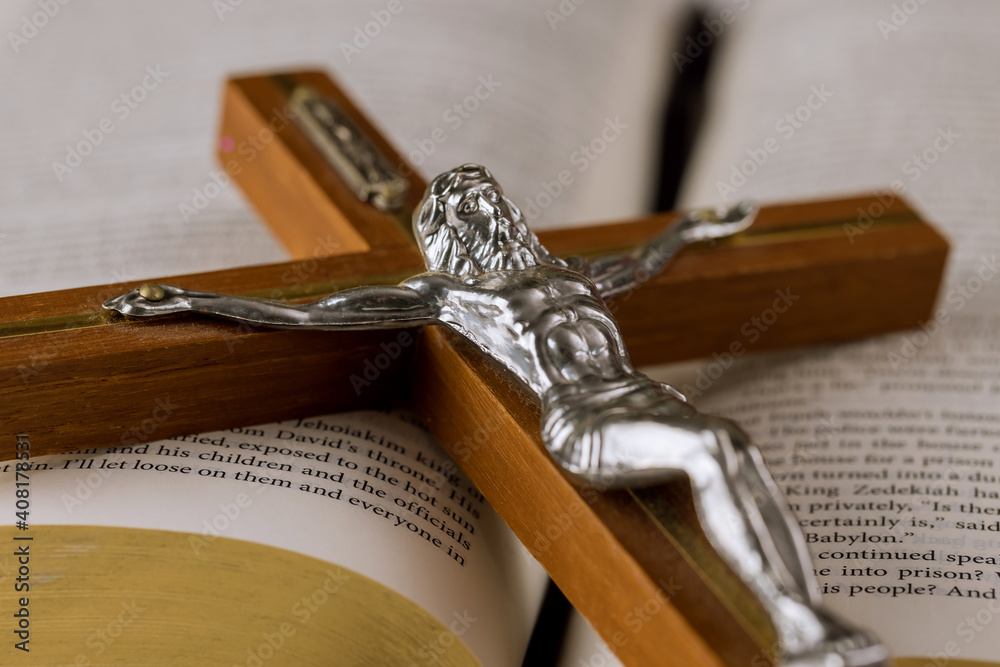 The Holy Bible on a Holy Cross of Jesus on way to God through prayer ...