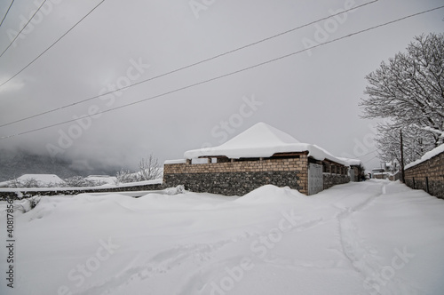 Winter mountain village landscape with snow and cute little houses, beautiful nature panoramic background