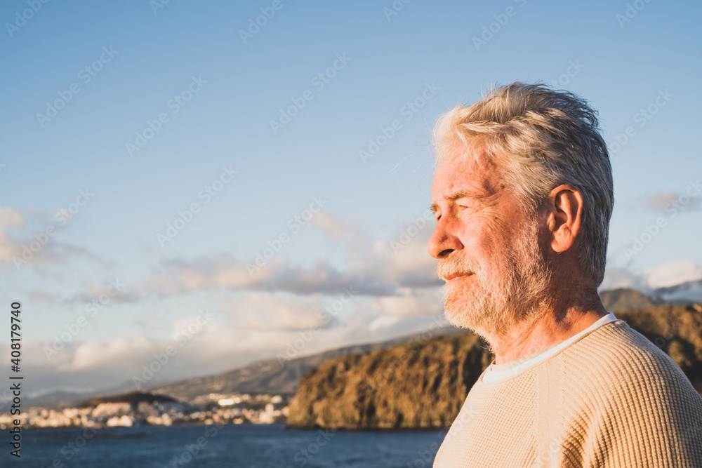 Fototapeta premium close up and portrait of sad and pensive man looking at the sea in the beach - upset people lifestyle concept