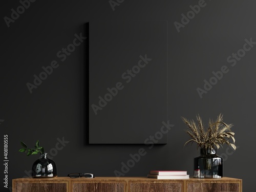 Mockup frame on cabinet in living room interior on empty dark wall background.