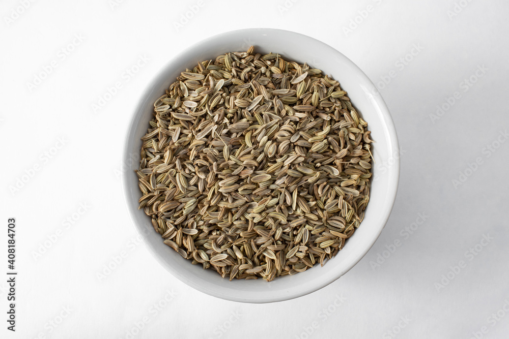 Top view of fennel seeds in bowl isolated on white background Top view of fennel seeds in bowl isolated on white background