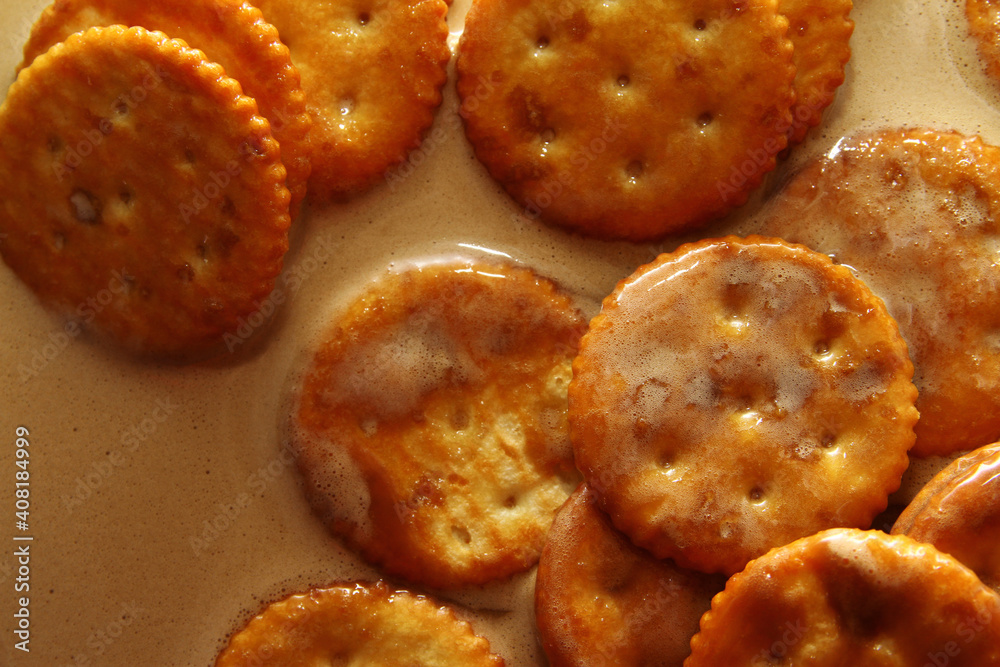 Dunk cheese crackers into hot drink