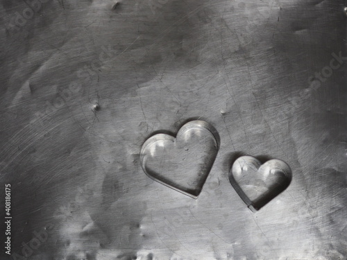 couple bread molds stainless Heart shaped on aluminum tray background, love Valentine Day for copy text card, background