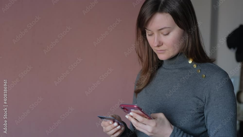 Attractive caucasian woman is using a credit card for ecommerce. Online commerce