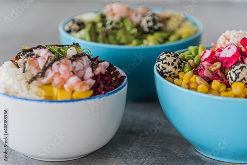 Fotografie Healthy poke bowl in wood background