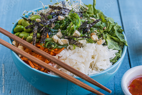 Healthy poke bowl in wood background photo