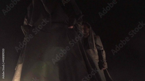 Sect. people in black coats. rite, cult