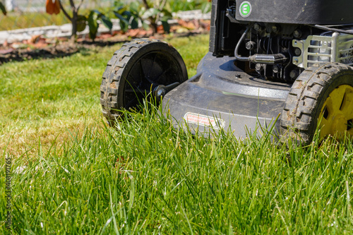 Using A Lawn Mower To Cut The Lawn - Close-up