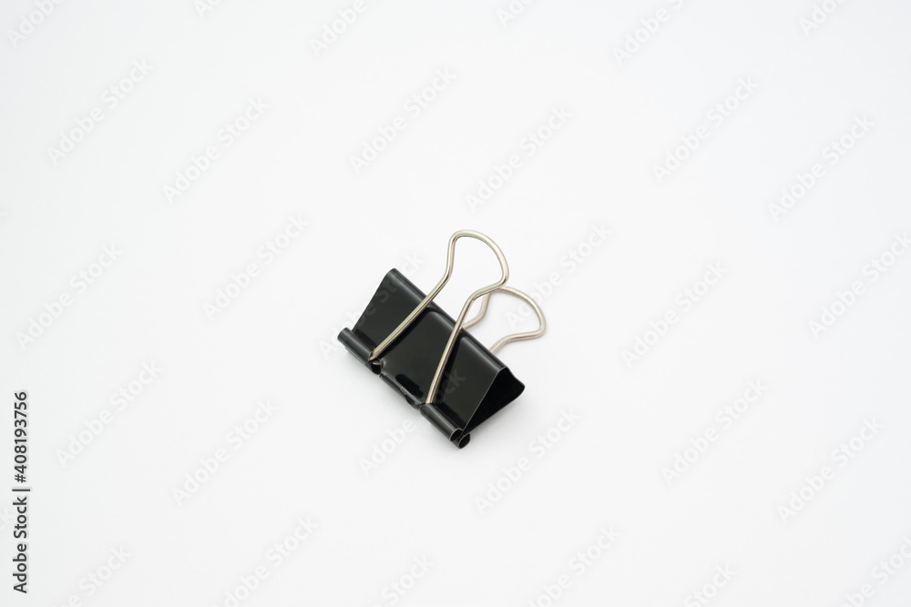 Paper clip black color on white background.Office tool on white background.Items used to clip paper in the office. Paper clip black color on white background.Office tool on white background.Items used to clip paper in the office.