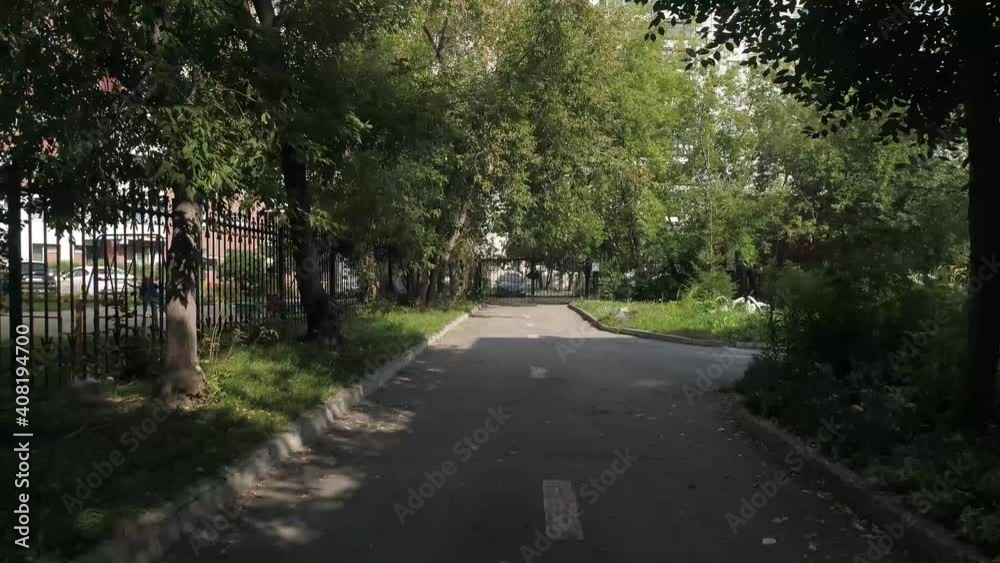 Drone view of asphalt road near preschool buildingand among trees. Around the kindergarten, a fence made of metal rods. Summer day
Drone view of asphalt road near preschool buildingand among trees. Around the kindergarten, a fence made of metal rods. Summer day