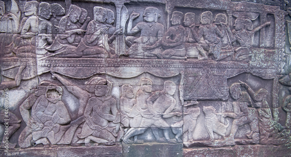  Bayon the central temple of Angkor Thom, late 12th century. Bas-relief. It rains in the rainy season. (Cambodia, 04.10. 2019)