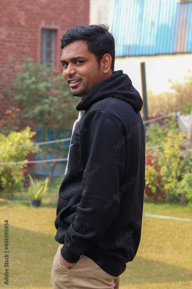 Close up attractive young man looking up in outdoor Close up attractive young man looking up in outdoor