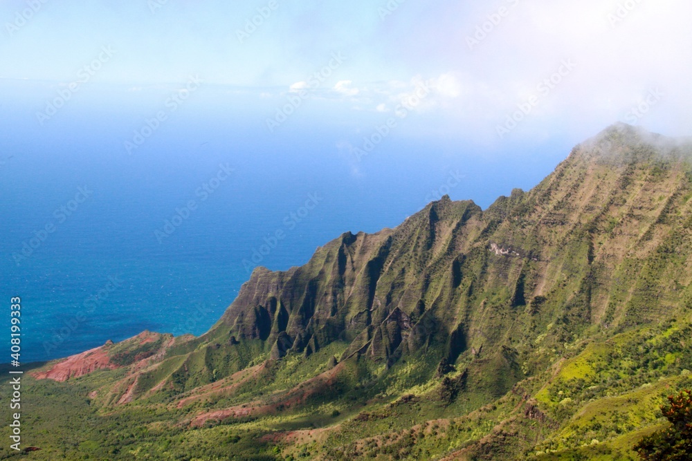 View from the lookout in Kokee State Park of the rugged Napali Coast on a brilliant sunny day.  