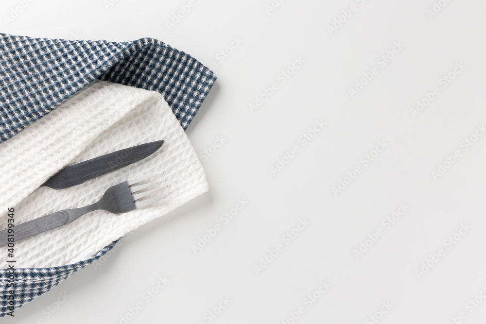 Knives, forks, were placed on a white tableware and napkins. Knives, forks, were placed on a white tableware and napkins.
