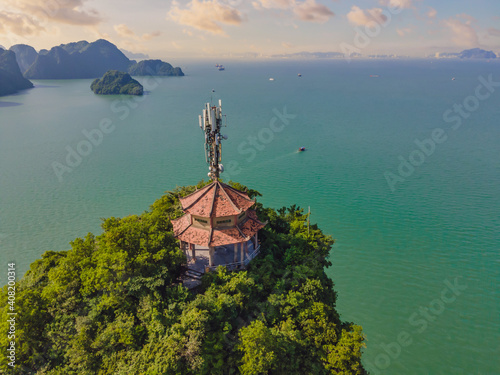 Aerial view panorama of floating fishing village and rock island, Halong Bay, Vietnam, Southeast Asia. UNESCO World Heritage Site. Junk boat cruise to Ha Long Bay. Popular landmark of Vietnam photo