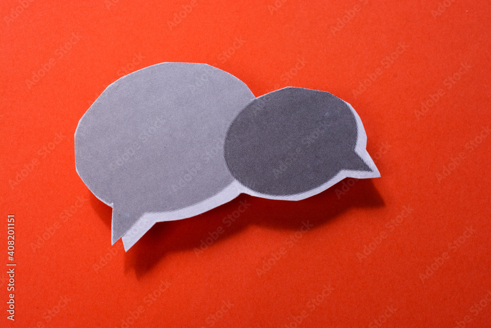 Mini speech bubbles cut out of paper in view Mini speech bubbles cut out of paper in view