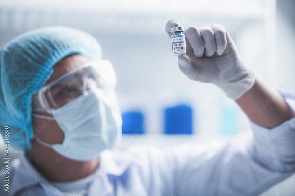 fight against COVID-19, coronavirus vaccine research in hospital laboratory, professional scientists holds bottle of new vaccine for virus cure treatment injection, medicine clinical during pandemic fight against COVID-19, coronavirus vaccine research in hospital laboratory, professional scientists holds bottle of new vaccine for virus cure treatment injection, medicine clinical during pandemic