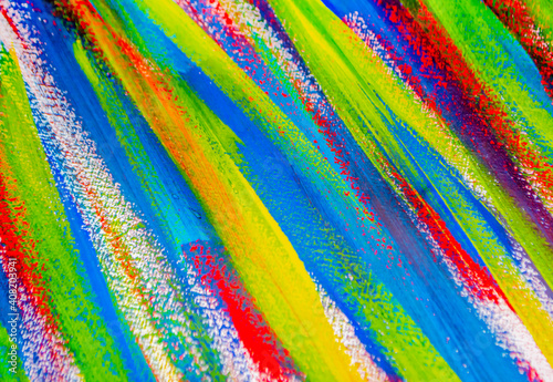 Background from different strokes of red, yellow, green and blue paint