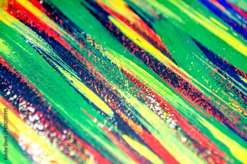 Background from different strokes of red, yellow, green and blue paint