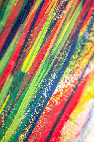 Background from different strokes of red, yellow, green and blue paint
