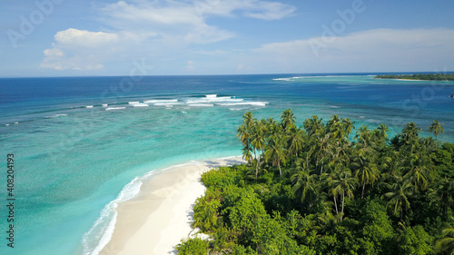 Fototapeta Naklejka Na Ścianę i Meble -  Aerial Seascape Tropical Island with Palm Trees & Sandy Beach & World-Class Waves