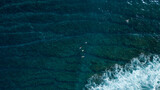 Surfers Surfing over Tropical Reef Aerial Drone View Ocean Reef Wave