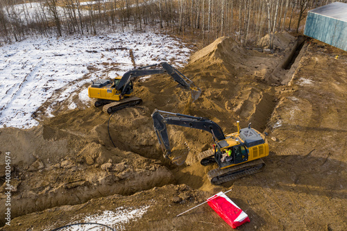 Construction equipment working to build an underground sewer system. photo