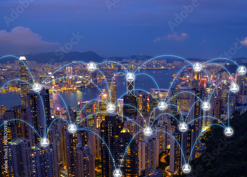Wireless networking diagram over cityscape at night that represent the internet communication in worldwild.