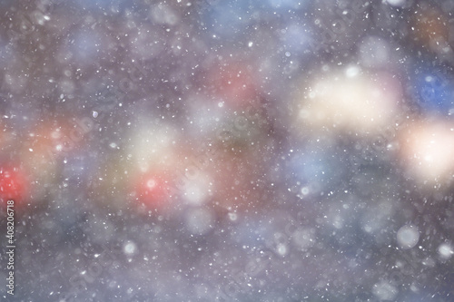 colorful background snow snowfall evening christmas lights, soft light blurry © kichigin19