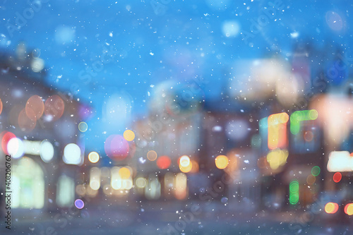 abstract snow blurred background city lights  winter holiday new year