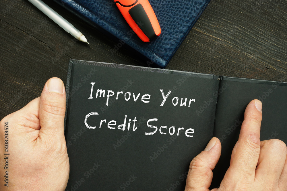 Lifestyle concept about Improve Your Credit Score with phrase on the piece of paper.