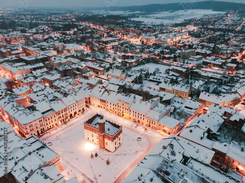 Fototapeta Naklejka Na Ścianę i Meble -  City Hall on Main City Square in Old Town. Tarnow MArket Square in Snow at Winter. City Lights.Poland