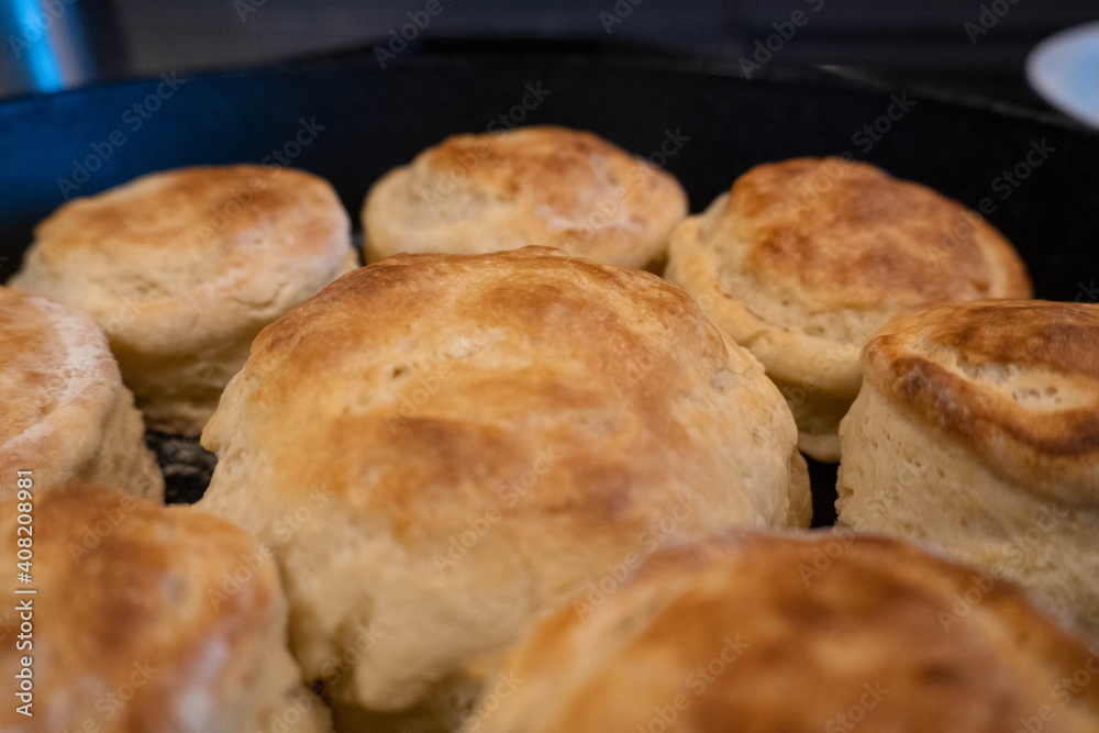 Freshly baked old fashioned buttermilk biscuits, southern cooking, front left in focus