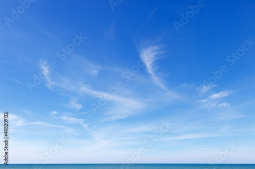 Fototapeta Naklejka Na Ścianę i Meble -  Beautiful blue sky over the sea with translucent, white, Cirrus clouds