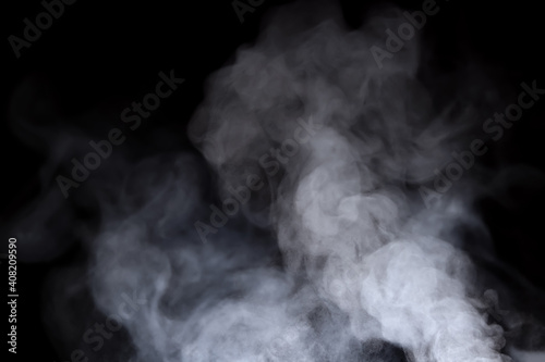 Close-up view of white water vapor with spray from the humidifier. Isolated on black background photo