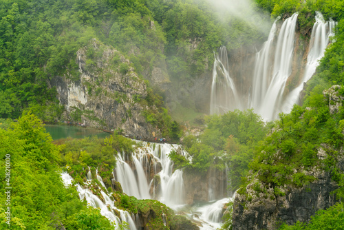 long exposure shot of veliki slap, the largest waterfall at plitvice, at on a rainy misty day at plitvice lakes national park