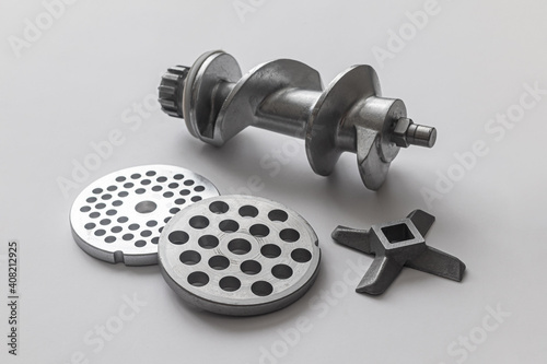 Knife, two grates and aluminum screw of electric meat grinder