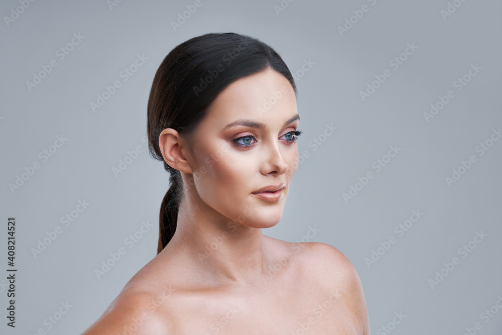 Portrait of beautiful woman on gray background Portrait of beautiful woman on gray background